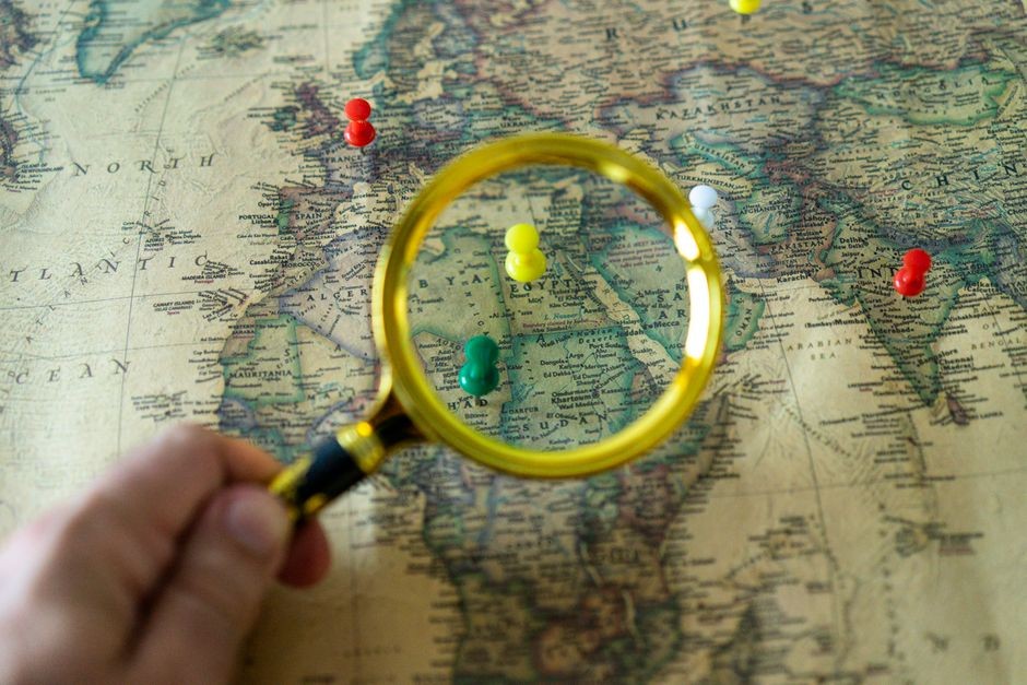 Map and magnifying glass on a table